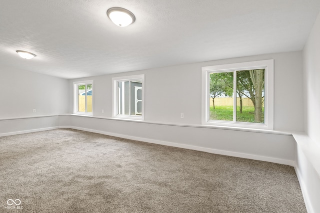 135 S Dr, Anderson, IN 46013 - carpeted spare room featuring baseboards and a textured ceiling