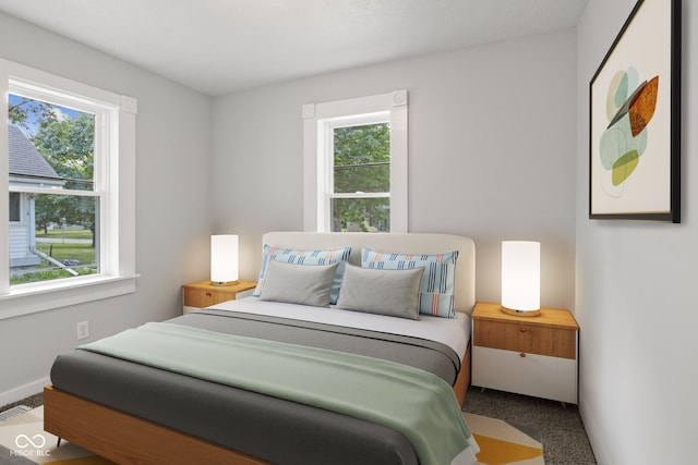 135 S Dr, Anderson, IN 46013 - carpeted bedroom featuring multiple windows