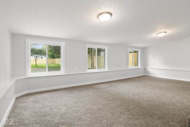 135 S Dr, Anderson, IN 46013 - carpeted empty room featuring baseboards and a textured ceiling