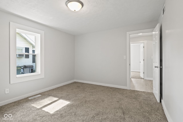 135 S Dr, Anderson, IN 46013 - unfurnished room featuring carpet floors and a textured ceiling