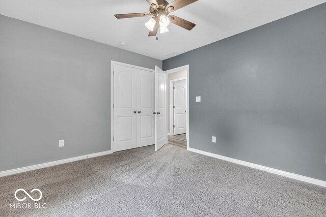 354 Mill Spgs, Fillmore, IN 46128 - unfurnished bedroom featuring carpet flooring, a ceiling fan, and a closet