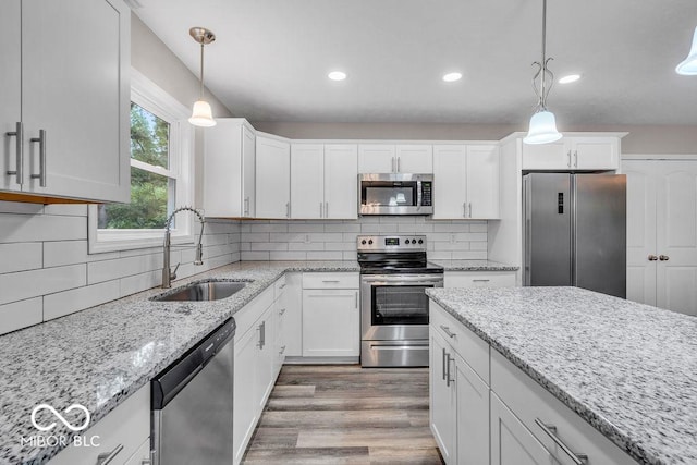 354 Mill Spgs, Fillmore, IN 46128 - kitchen with stainless steel appliances, white cabinets, pendant lighting, wood finished floors, and recessed lighting