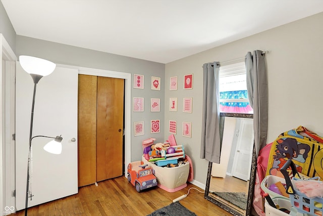 2630 Flintwood Dr, Columbus, IN 47203 - playroom featuring wood finished floors and baseboards