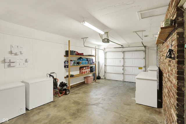 2630 Flintwood Dr, Columbus, IN 47203 - garage with a garage door opener and fridge