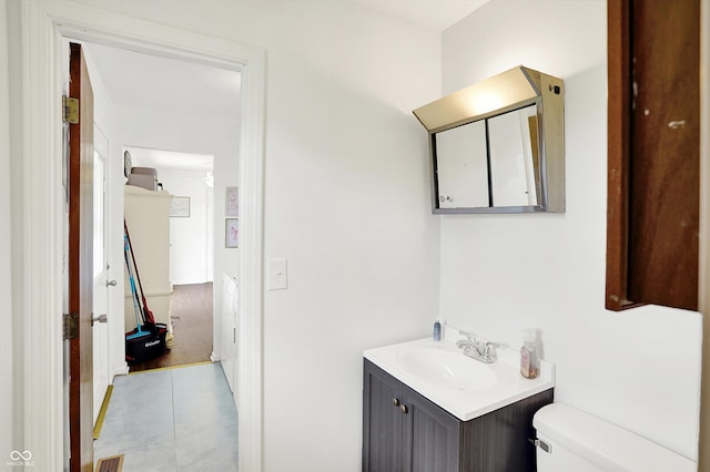 2630 Flintwood Dr, Columbus, IN 47203 - half bathroom featuring vanity and tile patterned floors