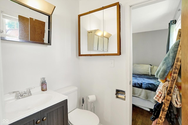 2630 Flintwood Dr, Columbus, IN 47203 - ensuite bathroom with vanity and wood finished floors