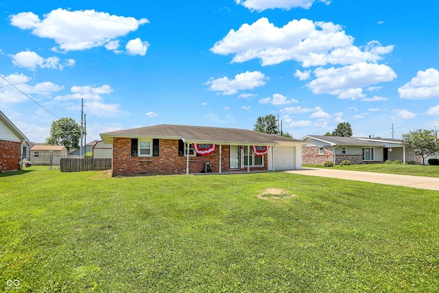 2630 Flintwood Dr, Columbus, IN 47203 - single story home featuring concrete driveway, a garage, and brick siding