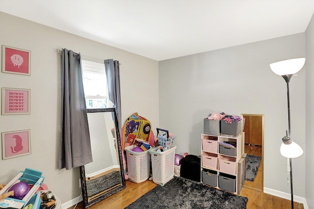 2630 Flintwood Dr, Columbus, IN 47203 - game room with wood finished floors and baseboards