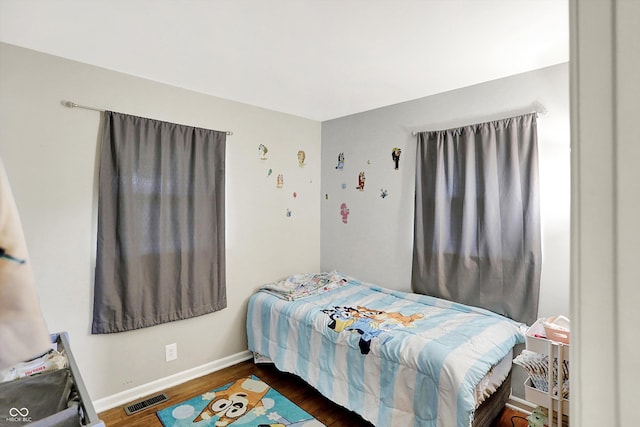2630 Flintwood Dr, Columbus, IN 47203 - bedroom with wood finished floors and baseboards