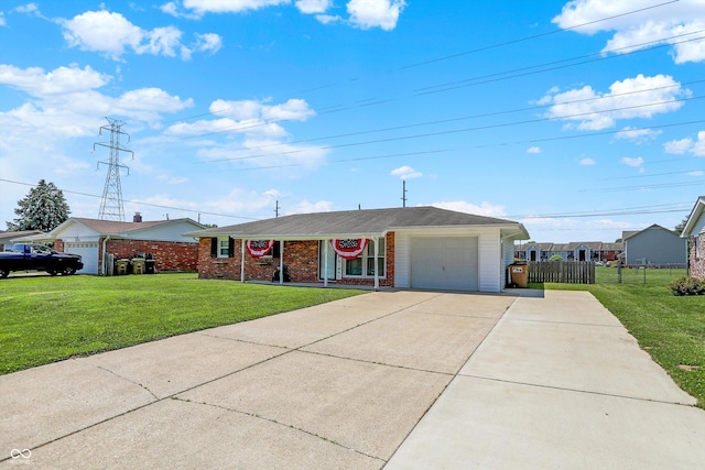 2630 Flintwood Dr, Columbus, IN 47203 - ranch-style house featuring concrete driveway, an attached garage, and brick siding