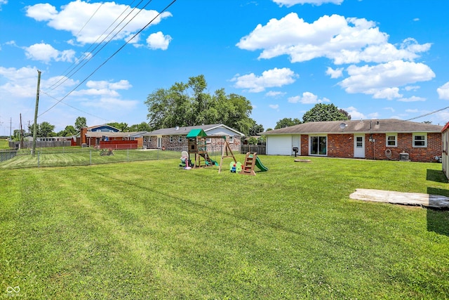 2630 Flintwood Dr, Columbus, IN 47203 - fenced backyard featuring a playground