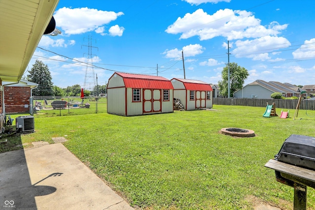 2630 Flintwood Dr, Columbus, IN 47203 - fenced backyard with a storage unit and an outdoor fire pit