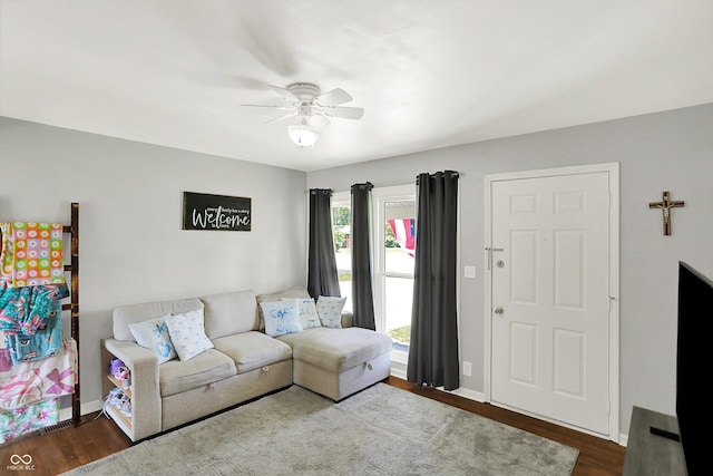 2630 Flintwood Dr, Columbus, IN 47203 - living area with a ceiling fan and dark wood-type flooring