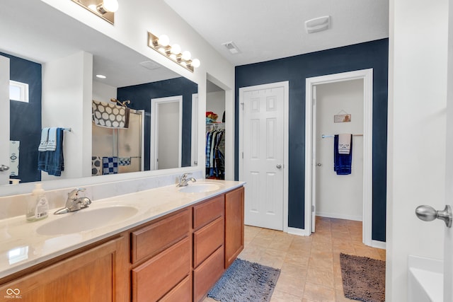 1397 Greenbriar Way, Franklin, IN 46131 - bathroom with a shower, double vanity, a walk in closet, and tile patterned flooring