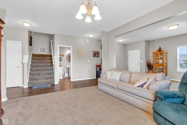 1397 Greenbriar Way, Franklin, IN 46131 - living room with a chandelier, carpet flooring, and stairway