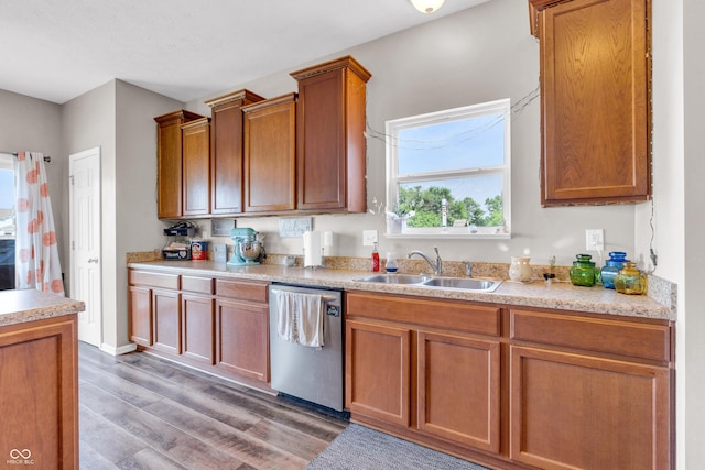 1397 Greenbriar Way, Franklin, IN 46131 - kitchen with stainless steel dishwasher, light countertops, light wood-type flooring, and brown cabinetry