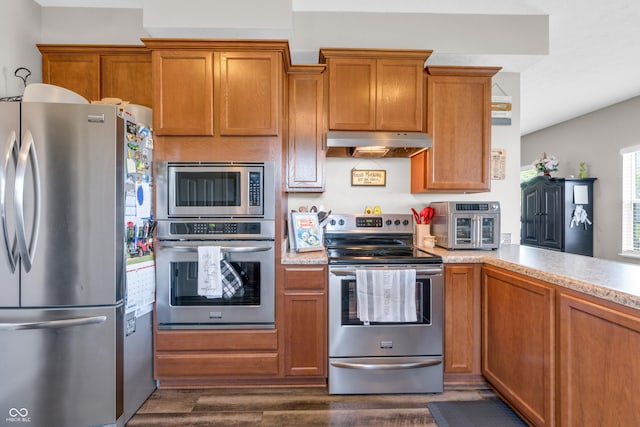 1397 Greenbriar Way, Franklin, IN 46131 - kitchen with appliances with stainless steel finishes, under cabinet range hood, dark wood finished floors, and brown cabinetry