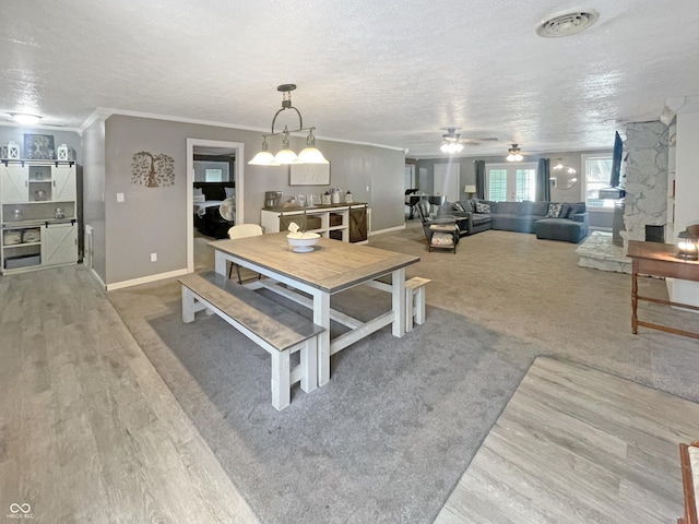 1446 W State Highway 46, Spencer, IN 47460 - dining space with a textured ceiling, wood finished floors, ornamental molding, and a ceiling fan
