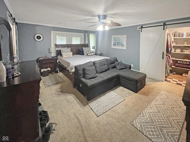 1446 W State Highway 46, Spencer, IN 47460 - bedroom with a barn door, crown molding, carpet floors, ceiling fan, and a spacious closet