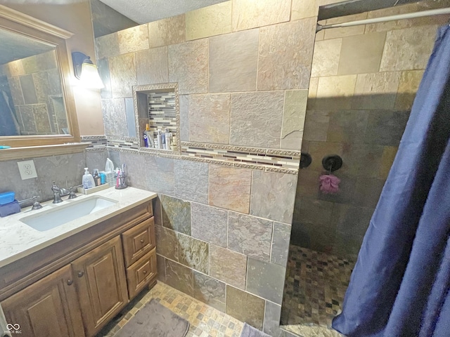 1446 W State Highway 46, Spencer, IN 47460 - bathroom featuring tiled shower, tile walls, and vanity