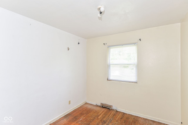 4218 N Irvington Ave, Indianapolis, IN 46226 - spare room featuring wood finished floors and baseboards