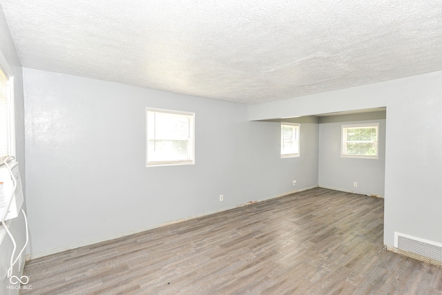 4218 N Irvington Ave, Indianapolis, IN 46226 - unfurnished room featuring wood finished floors and a textured ceiling