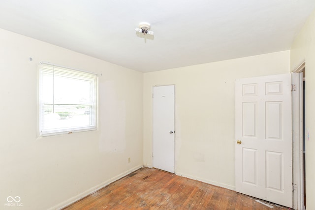 4218 N Irvington Ave, Indianapolis, IN 46226 - unfurnished bedroom featuring hardwood / wood-style floors and a closet