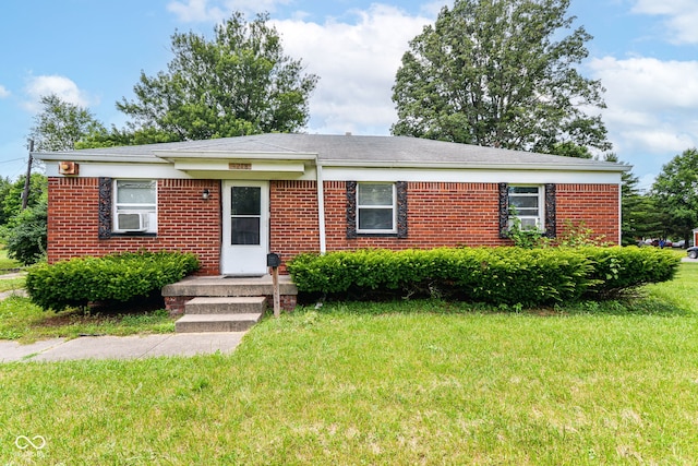 4218 N Irvington Ave, Indianapolis, IN 46226 - ranch-style house with a front lawn, brick siding, and cooling unit