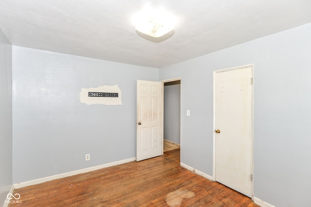 4218 N Irvington Ave, Indianapolis, IN 46226 - spare room with wood finished floors and baseboards