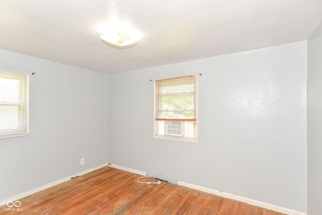4218 N Irvington Ave, Indianapolis, IN 46226 - spare room featuring wood finished floors and cooling unit