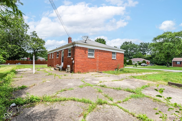 4218 N Irvington Ave, Indianapolis, IN 46226 - view of property exterior with brick siding and a chimney