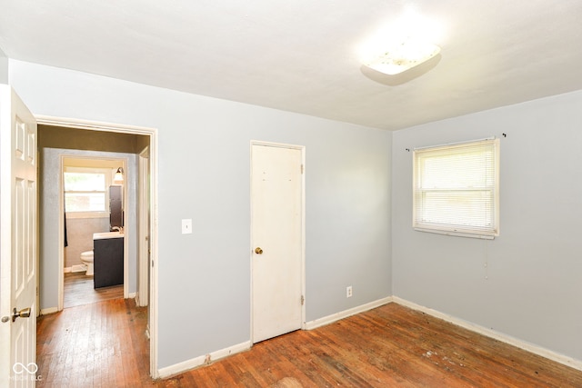 4218 N Irvington Ave, Indianapolis, IN 46226 - unfurnished bedroom with hardwood / wood-style flooring and baseboards