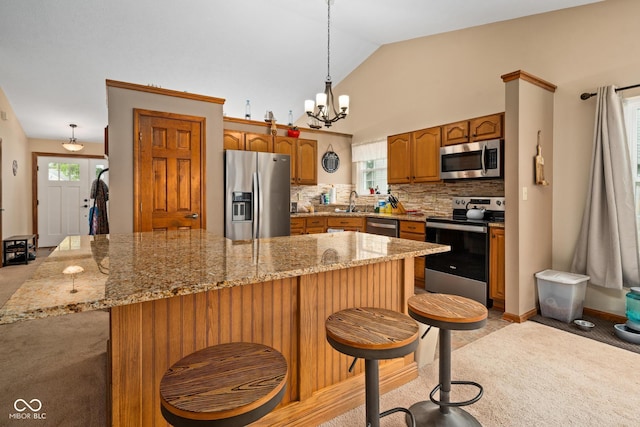 48 Lasalle Ct, Whiteland, IN 46184 - kitchen with stainless steel appliances, light colored carpet, healthy amount of natural light, a chandelier, and lofted ceiling