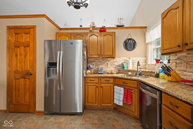 48 Lasalle Ct, Whiteland, IN 46184 - kitchen with appliances with stainless steel finishes, light stone counters, tasteful backsplash, and brown cabinets