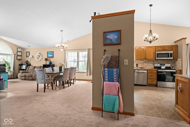 48 Lasalle Ct, Whiteland, IN 46184 - dining space featuring a chandelier, light carpet, healthy amount of natural light, and high vaulted ceiling