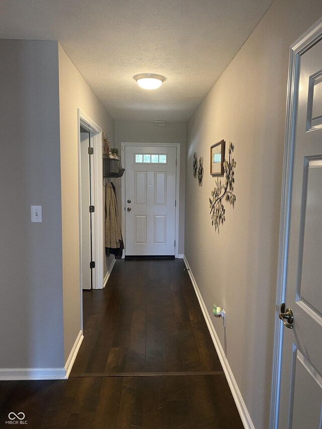 1675 Leisure Way, Greenfield, IN 46140 - doorway to outside with wood finished floors and a textured ceiling