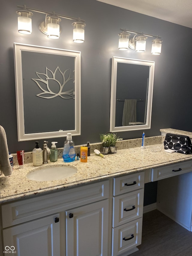 1675 Leisure Way, Greenfield, IN 46140 - bathroom with double vanity and wood finished floors