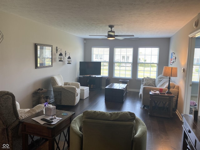 1675 Leisure Way, Greenfield, IN 46140 - living area with a ceiling fan, dark wood finished floors, healthy amount of natural light, and a textured ceiling