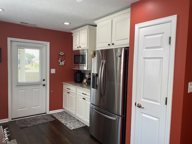 1675 Leisure Way, Greenfield, IN 46140 - kitchen featuring stainless steel appliances, white cabinets, recessed lighting, dark wood-style flooring, and tasteful backsplash