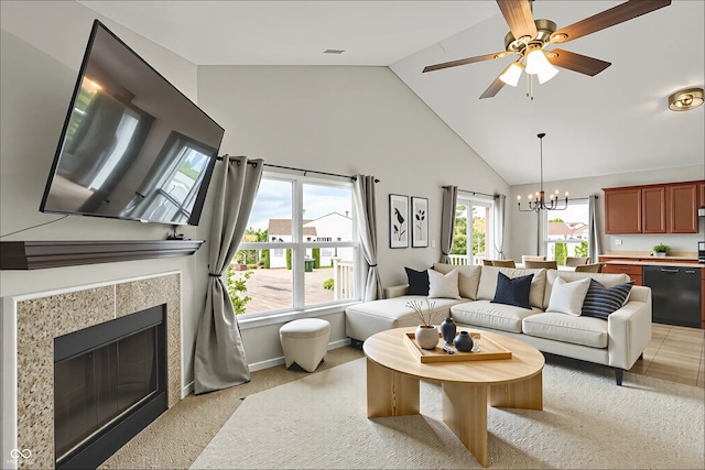 13225 Deception Pass Unit 700, Fishers, IN 46038 - living room featuring high vaulted ceiling, healthy amount of natural light, light colored carpet, a chandelier, and a tiled fireplace