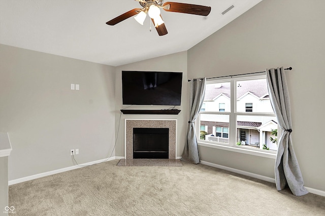 13225 Deception Pass Unit 700, Fishers, IN 46038 - unfurnished living room featuring vaulted ceiling, carpet flooring, a tile fireplace, and ceiling fan