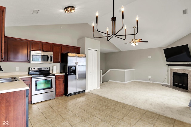 13225 Deception Pass Unit 700, Fishers, IN 46038 - kitchen featuring appliances with stainless steel finishes, light carpet, open floor plan, a chandelier, and light countertops