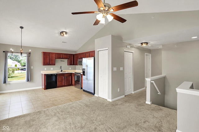 13225 Deception Pass Unit 700, Fishers, IN 46038 - kitchen featuring appliances with stainless steel finishes, light countertops, reddish brown cabinets, open floor plan, and light tile patterned flooring