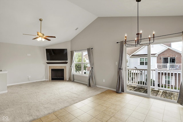 13225 Deception Pass Unit 700, Fishers, IN 46038 - unfurnished living room with carpet flooring, a chandelier, high vaulted ceiling, a fireplace, and tile patterned flooring