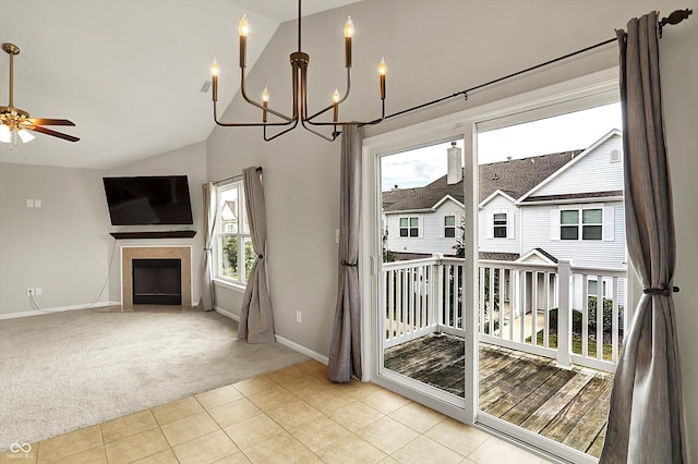 13225 Deception Pass Unit 700, Fishers, IN 46038 - unfurnished dining area featuring a chandelier, lofted ceiling, a fireplace with flush hearth, carpet, and ceiling fan