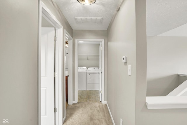 13225 Deception Pass Unit 700, Fishers, IN 46038 - hall with separate washer and dryer, light colored carpet, and a textured ceiling