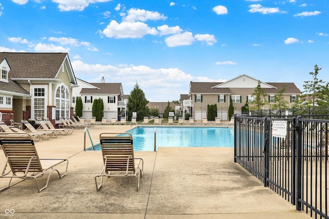 13225 Deception Pass Unit 700, Fishers, IN 46038 - community pool with a patio area and a residential view