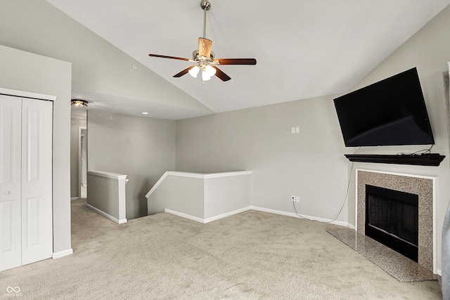 13225 Deception Pass Unit 700, Fishers, IN 46038 - unfurnished living room featuring carpet flooring, ceiling fan, a fireplace, and high vaulted ceiling