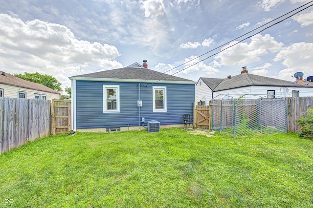 1810 Calhoun St, Indianapolis, IN 46203 - back of house with a fenced backyard and a gate