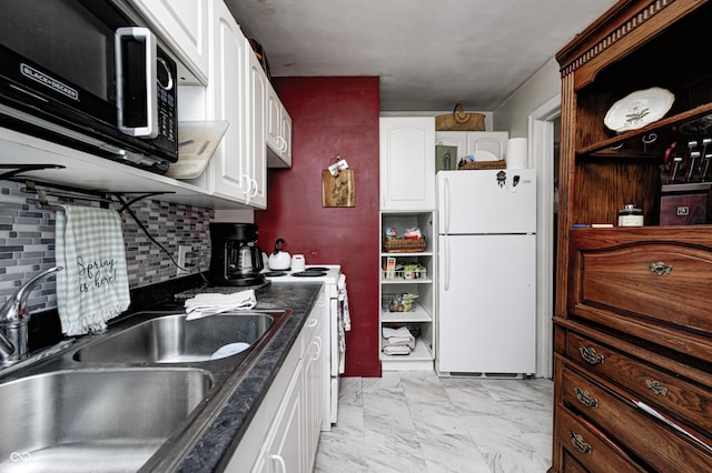 1810 Calhoun St, Indianapolis, IN 46203 - kitchen with white appliances, light marble finish flooring, white cabinets, and dark countertops